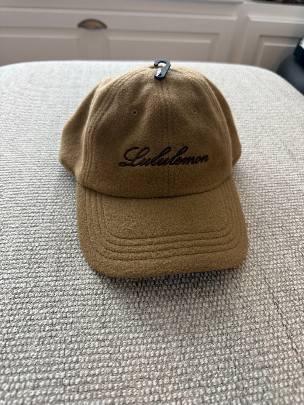 lululemon athletica tan brown wool cap with metal logo clasp
